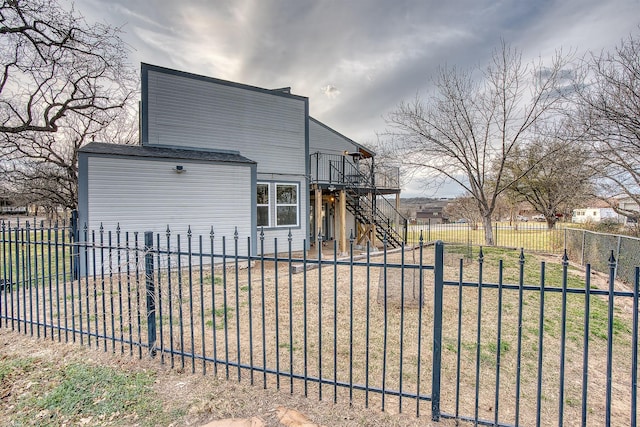 237 Runaway Bay Dr, Runaway Bay, TX 76426 - rear view of house with a deck, stairway, and a fenced backyard