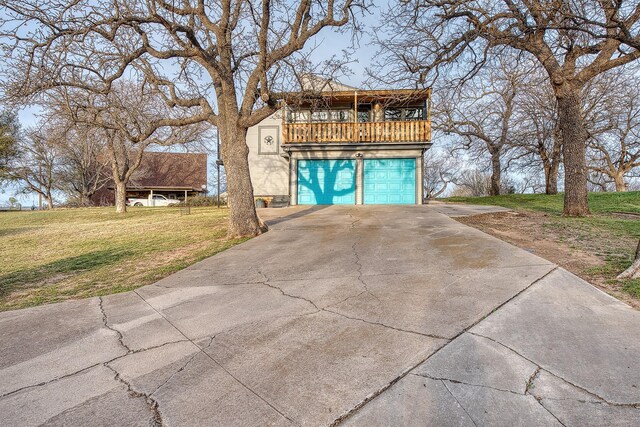 237 Runaway Bay Dr, Runaway Bay, TX 76426 - view of front of home with driveway, a front yard, and a garage