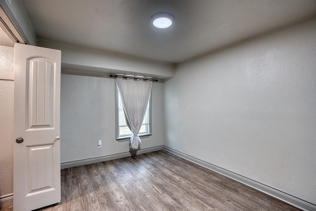 237 Runaway Bay Dr, Runaway Bay, TX 76426 - spare room featuring wood finished floors and baseboards