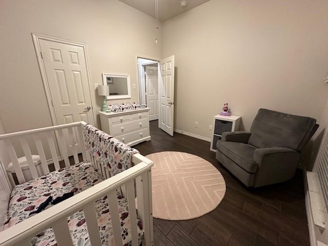 1615 Summerfield Dr, Allen, TX 75002 - bedroom with dark wood-style floors and baseboards