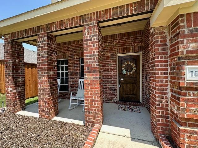 1615 Summerfield Dr, Allen, TX 75002 - view of exterior entry featuring brick siding