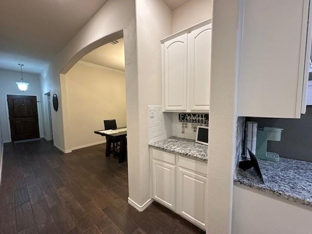 1615 Summerfield Dr, Allen, TX 75002 - corridor featuring arched walkways, dark wood-style flooring, and baseboards