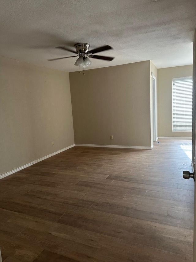 2612 Lemmontree Ln, Plano, TX 75074 - empty room with wood finished floors, a ceiling fan, baseboards, and a textured ceiling