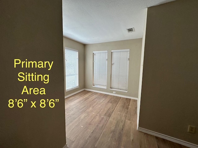 2612 Lemmontree Ln, Plano, TX 75074 - hallway with baseboards, wood finished floors, and a textured ceiling