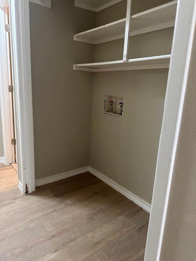 2612 Lemmontree Ln, Plano, TX 75074 - laundry room featuring washer hookup, wood finished floors, and baseboards