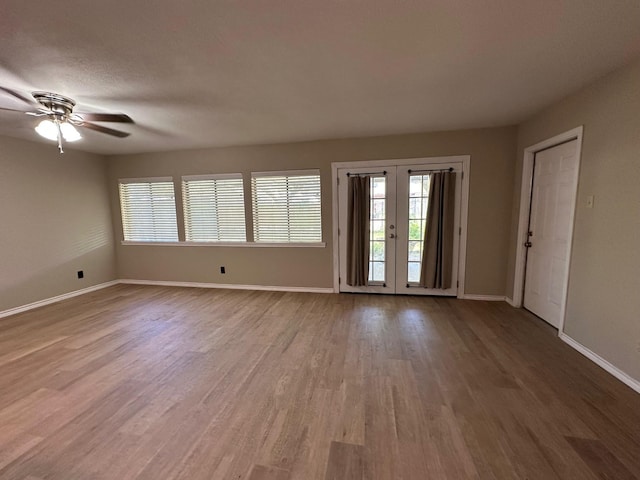 2612 Lemmontree Ln, Plano, TX 75074 - empty room featuring wood finished floors, baseboards, ceiling fan, and french doors