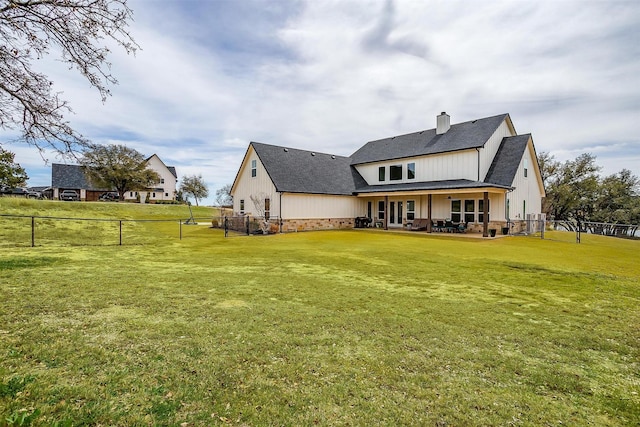 201 Flat Rock Ln, Weatherford, TX 76088 - rear view of house featuring a chimney, a patio area, a shingled roof, and board and batten siding