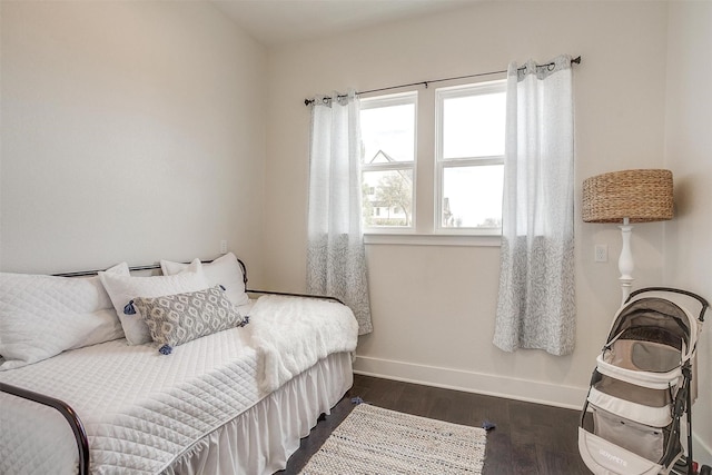 201 Flat Rock Ln, Weatherford, TX 76088 - bedroom with baseboards and dark wood-type flooring