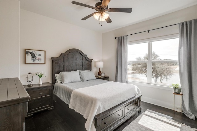 201 Flat Rock Ln, Weatherford, TX 76088 - bedroom featuring dark wood-type flooring, baseboards, and a ceiling fan