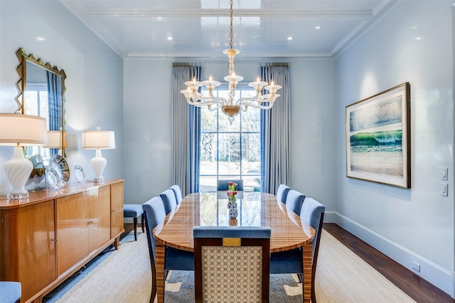 dining room featuring wood finished floors, baseboards, recessed lighting, ornamental molding, and a chandelier