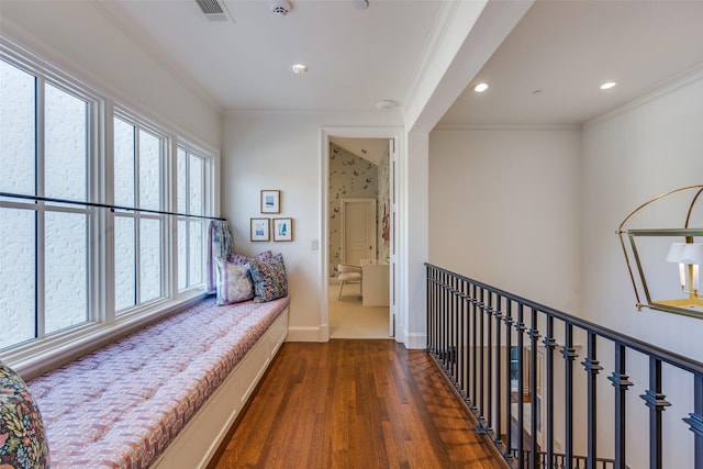 hall featuring visible vents, baseboards, ornamental molding, recessed lighting, and wood finished floors