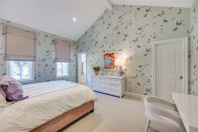 bedroom with wallpapered walls, beam ceiling, baseboards, and light carpet