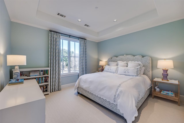 bedroom featuring a raised ceiling, light colored carpet, visible vents, and baseboards