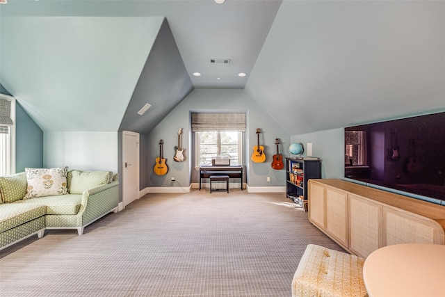living room featuring visible vents, baseboards, light colored carpet, and lofted ceiling