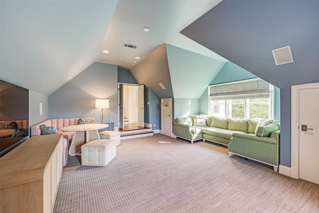 bedroom with vaulted ceiling, carpet, and visible vents