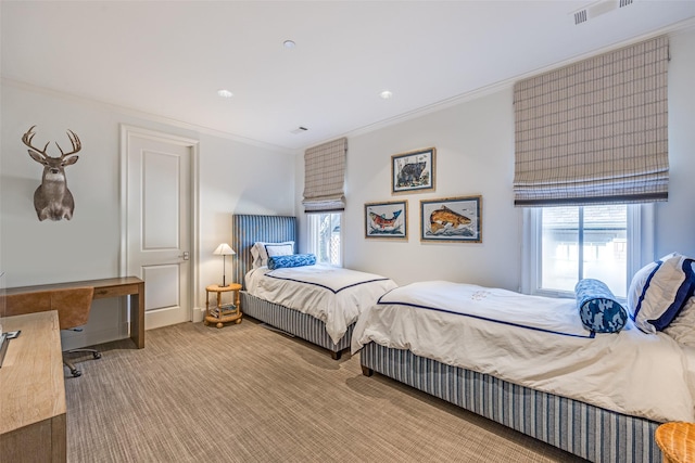 bedroom featuring visible vents, ornamental molding, multiple windows, and carpet floors