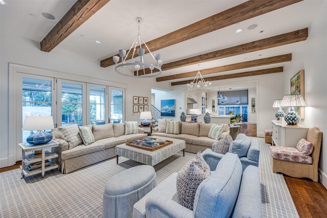 living room with recessed lighting, beamed ceiling, wood finished floors, and a chandelier