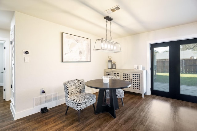 1025 Oak Hurst Dr, Grapevine, TX 76051 - dining area with dark wood-style flooring, baseboards, and french doors