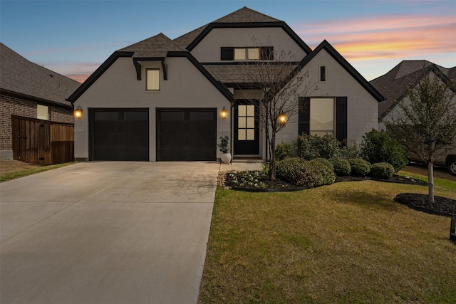 view of exterior entry featuring an attached garage and brick siding