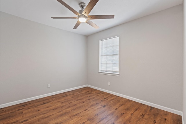 empty room with wood finished floors, baseboards, and ceiling fan