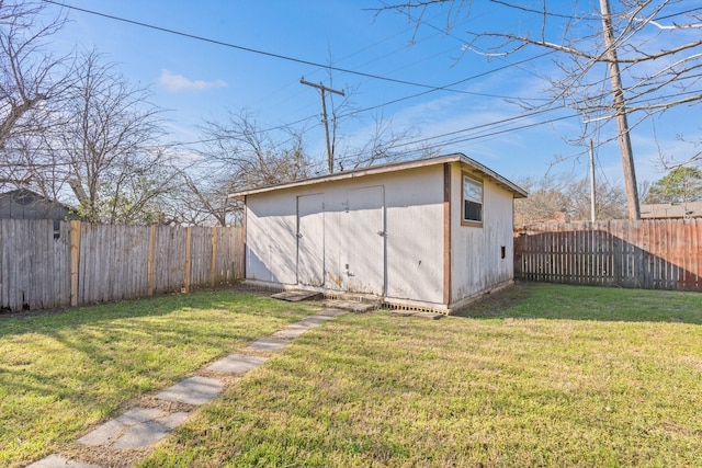 view of shed with a fenced backyard