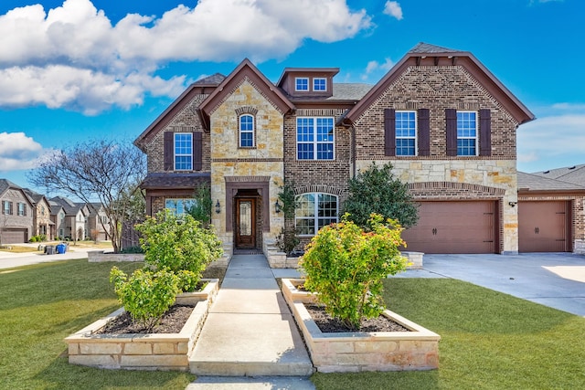view of front of property featuring stone siding, driveway, a front lawn, and brick siding