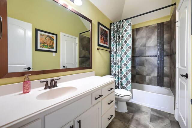 bathroom featuring toilet, vanity, and shower / tub combo