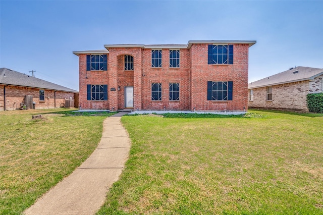 colonial inspired home featuring central AC, brick siding, and a front lawn