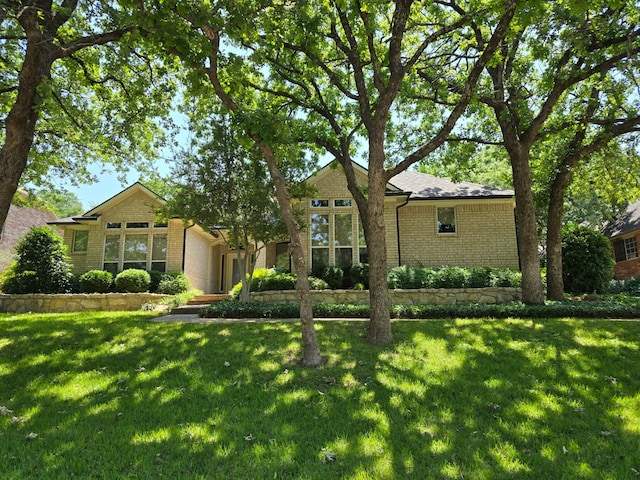 1505 Valley Creek Rd, Denton, TX 76205 - view of front of house with brick siding and a front lawn