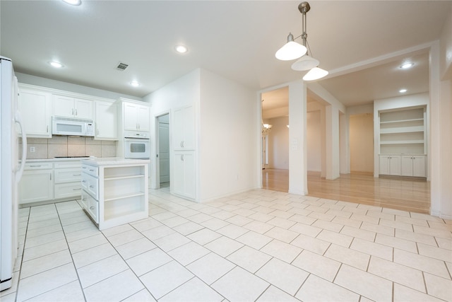 1505 Valley Creek Rd, Denton, TX 76205 - kitchen featuring white appliances, open shelves, open floor plan, light countertops, and white cabinets