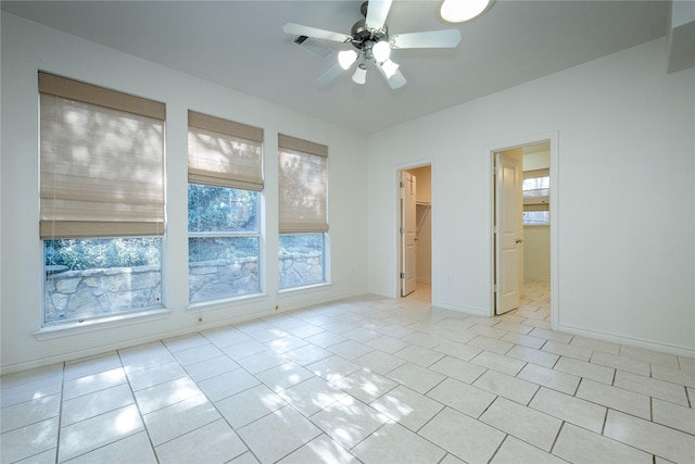 1505 Valley Creek Rd, Denton, TX 76205 - empty room featuring a ceiling fan, light tile patterned floors, and baseboards