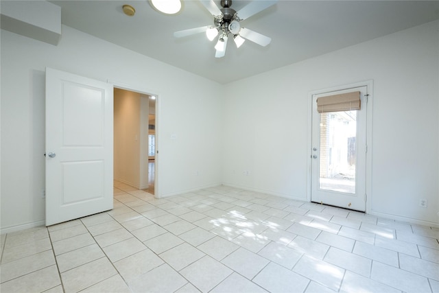 1505 Valley Creek Rd, Denton, TX 76205 - spare room featuring ceiling fan, a smoke detector, light tile patterned floors, and baseboards