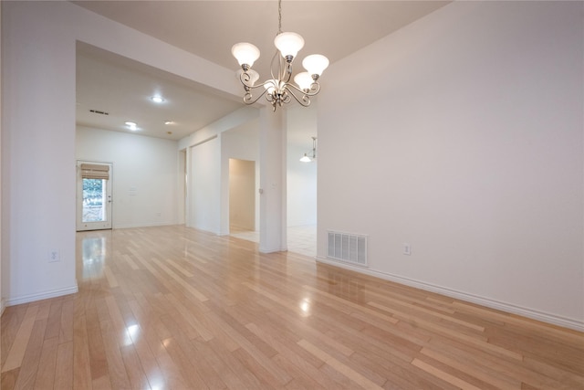 1505 Valley Creek Rd, Denton, TX 76205 - unfurnished room featuring a chandelier, light wood finished floors, and baseboards
