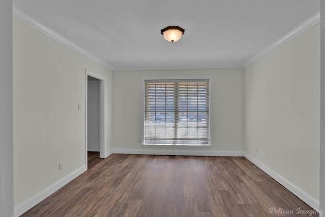 empty room with crown molding, dark wood-type flooring, and baseboards