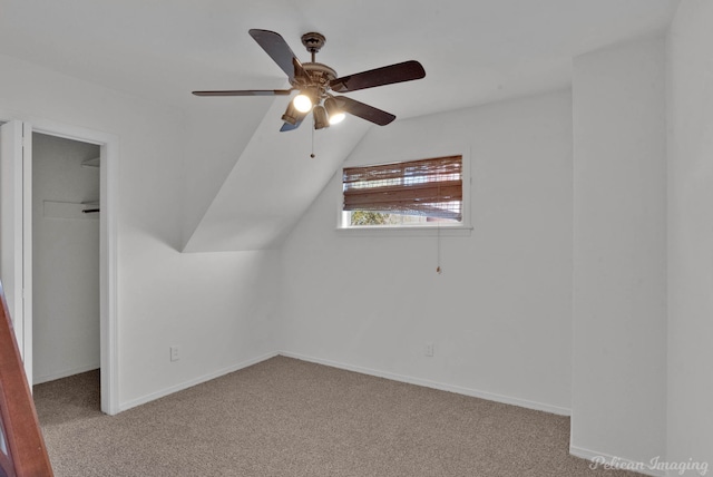 bonus room featuring baseboards, carpet, and a ceiling fan