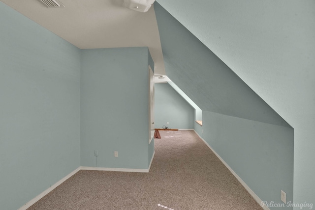 bonus room featuring carpet flooring, baseboards, and lofted ceiling