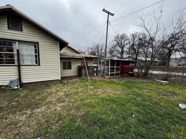 view of yard with an outdoor structure and fence