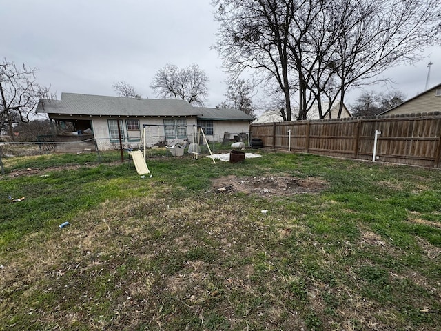 view of yard with a fenced backyard