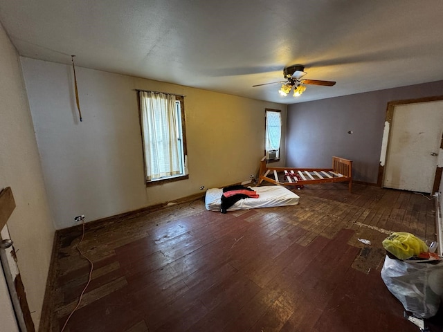 interior space featuring cooling unit, a ceiling fan, and wood-type flooring