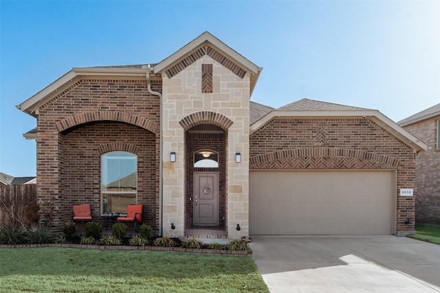 9032 Weepy Hollow Trl, Fort Worth, TX 76179 - french country inspired facade featuring brick siding, roof with shingles, a garage, stone siding, and driveway