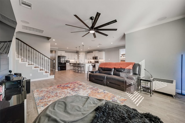 9032 Weepy Hollow Trl, Fort Worth, TX 76179 - living area with visible vents, stairway, crown molding, and ceiling fan