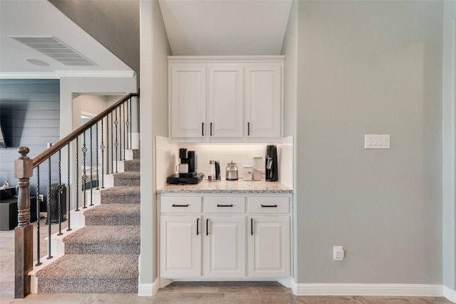 9032 Weepy Hollow Trl, Fort Worth, TX 76179 - bar featuring tasteful backsplash, visible vents, baseboards, stairway, and ornamental molding