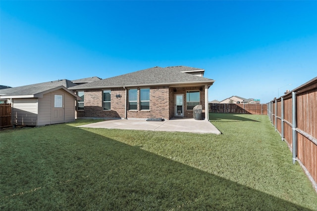 9032 Weepy Hollow Trl, Fort Worth, TX 76179 - rear view of property featuring a lawn, a patio, a fenced backyard, an outdoor structure, and brick siding