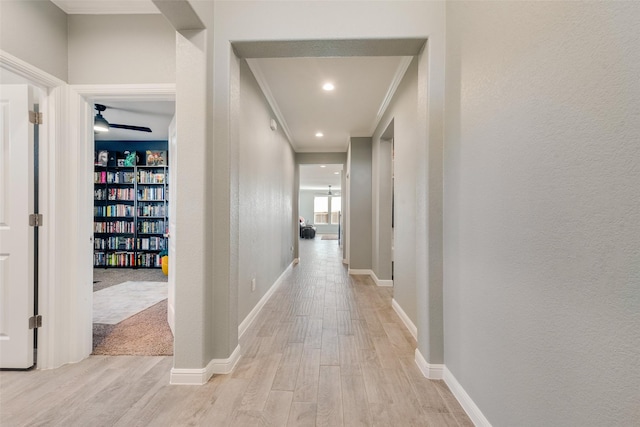 9032 Weepy Hollow Trl, Fort Worth, TX 76179 - hallway with light wood finished floors, crown molding, baseboards, recessed lighting, and a textured wall