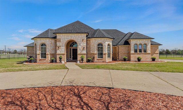 477 Horseshoe Bnd, Royse City, TX 75189 - french country inspired facade with stone siding, roof with shingles, and brick siding