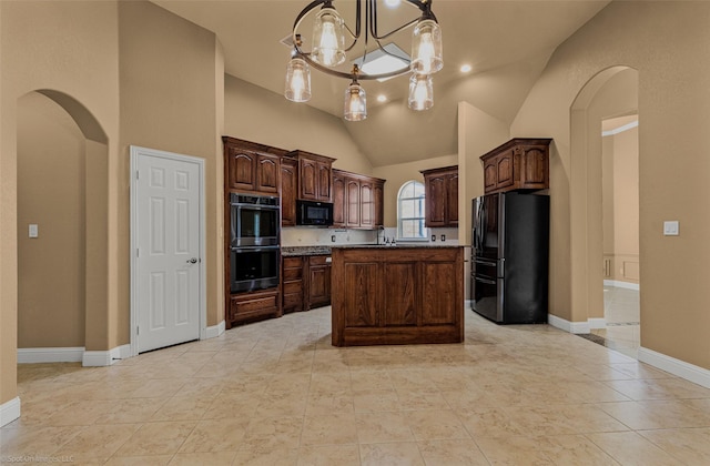 477 Horseshoe Bnd, Royse City, TX 75189 - kitchen with black appliances, arched walkways, vaulted ceiling, a kitchen island, and a chandelier