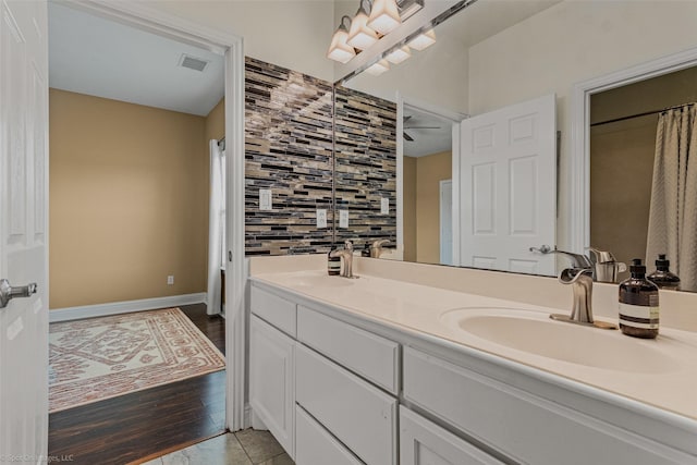 477 Horseshoe Bnd, Royse City, TX 75189 - full bathroom with double vanity, tasteful backsplash, and wood finished floors