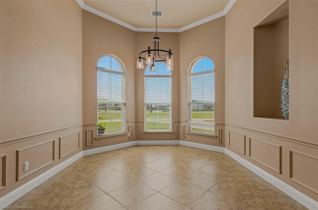 477 Horseshoe Bnd, Royse City, TX 75189 - unfurnished dining area featuring a chandelier, a decorative wall, ornamental molding, light tile patterned floors, and a wainscoted wall