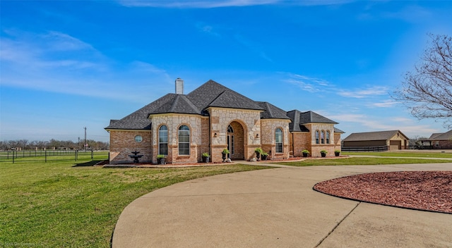 477 Horseshoe Bnd, Royse City, TX 75189 - french country home with stone siding, a chimney, curved driveway, and brick siding