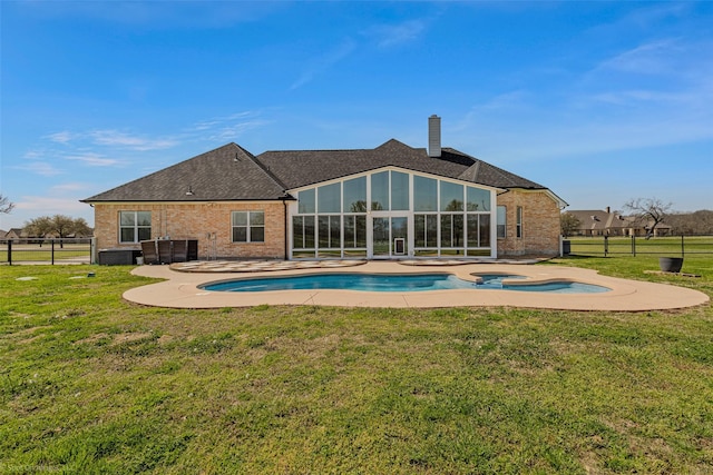 477 Horseshoe Bnd, Royse City, TX 75189 - back of property with brick siding, a patio, a chimney, and a sunroom